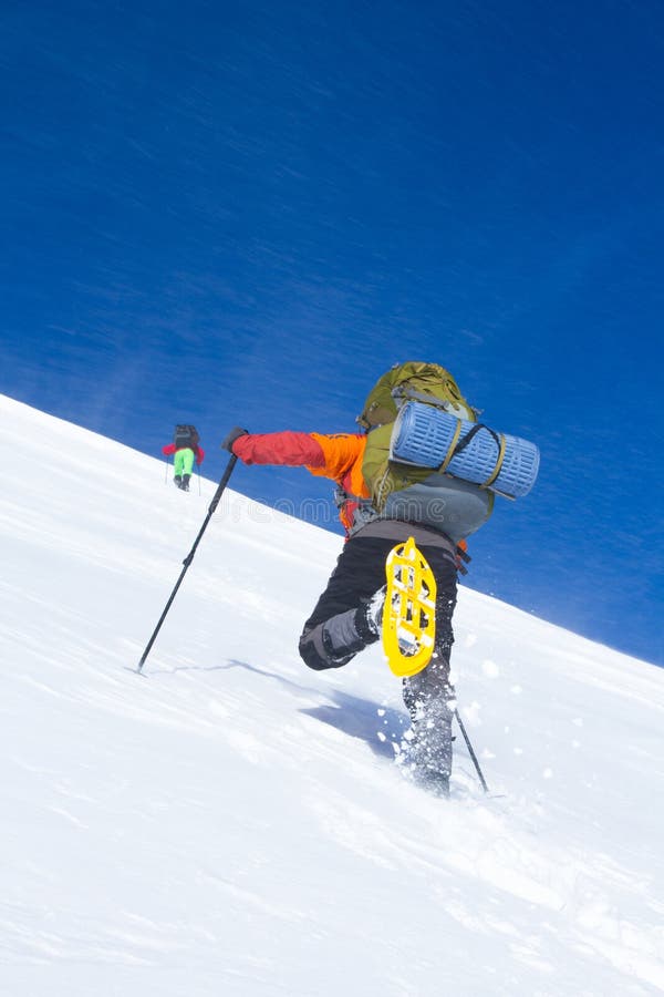 Winter hiking in the mountains on snowshoes with a backpack and tent. Winter trekking. Backpack snowshoeing stock images, royalty-free photos and pictures