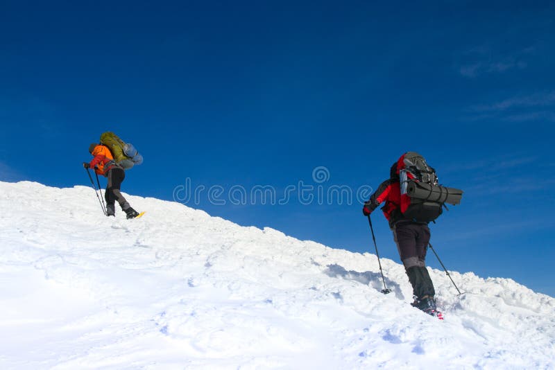 Winter hiking in the mountains on snowshoes with a backpack and tent. Hiking. Backpack snowshoeing stock images, royalty-free photos and pictures