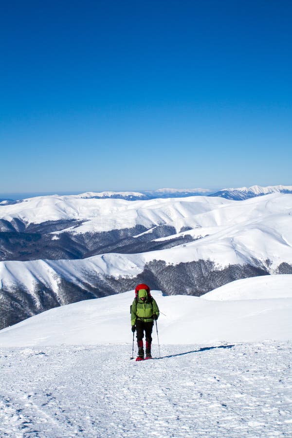Winter Hiking in the Mountains on Snowshoes with a Backpack and Tent. Stock Image Image of
