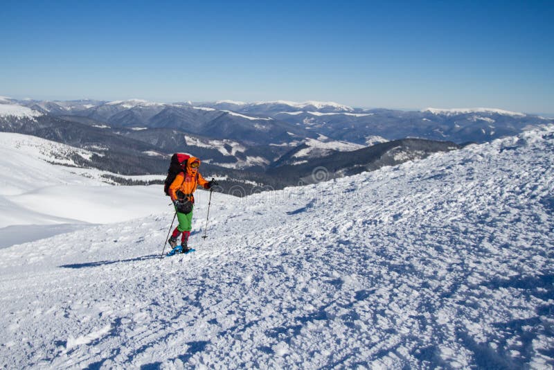 Winter hiking in the mountains on snowshoes with a backpack and tent. Backpack snowshoeing stock images, royalty-free photos and pictures