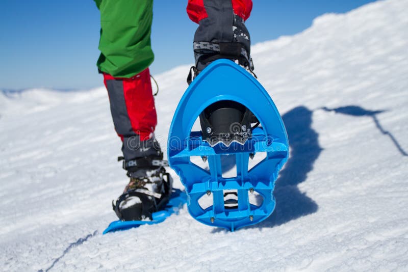 Winter hiking in the mountains on snowshoes with a backpack and tent. Backpack snowshoeing stock images, royalty-free photos and pictures