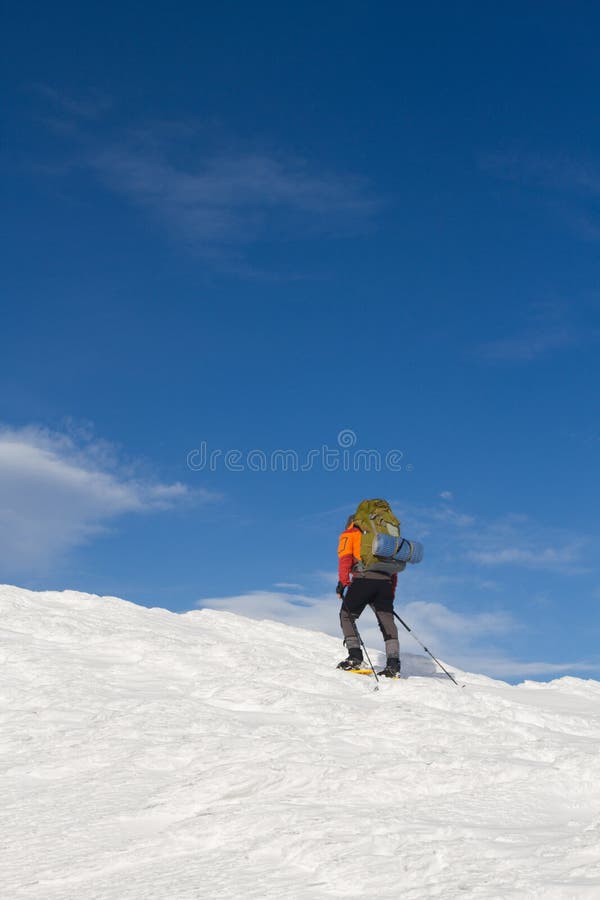 Winter hiking in the mountains on snowshoes with a backpack and tent. Backpack snowshoeing stock images, royalty-free photos and pictures