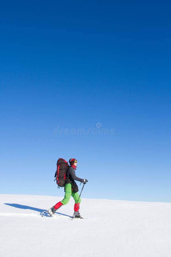 Winter hiking in the mountains on snowshoes with a backpack and tent. Backpack snowshoeing stock images, royalty-free photos and pictures