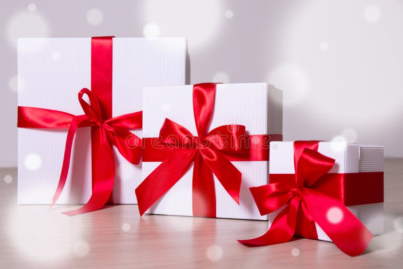 Winter Holiday Concept - White Gift Boxes with Red Ribbon on Woo Stock ...