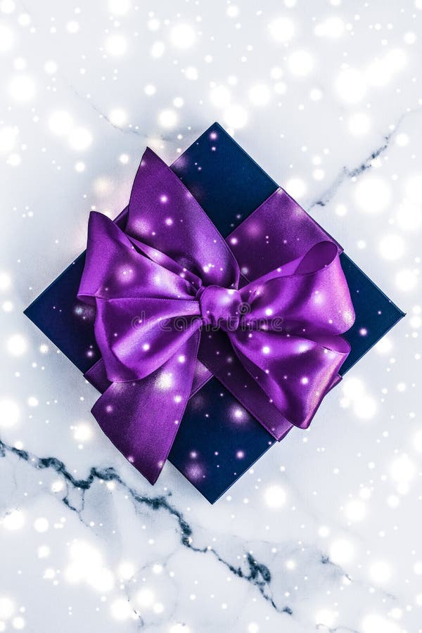 Winter Holiday Gift Box with Purple Silk Bow, Snow Glitter on Marble  Background As Christmas and New Years Presents for Luxury Stock Photo -  Image of brand, christmas: 163817212
