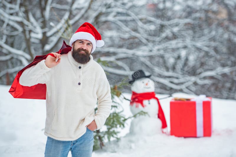 Winter holidays and people concept. Christmas shopping with shopping bag. Enjoying nature wintertime. Christmas sale and stock images Winter holidays and people concept. Christmas shopping with shopping bag. Enjoying nature wintertime. Christmas sale and stock images