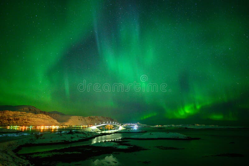 Winter landscape with Aurora Borealis in Lofoten archipelago , Norway northern lights.