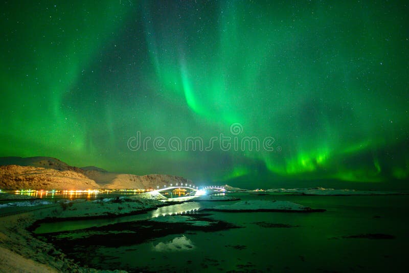 Winter landscape with Aurora Borealis in Lofoten archipelago , Norway northern lights.