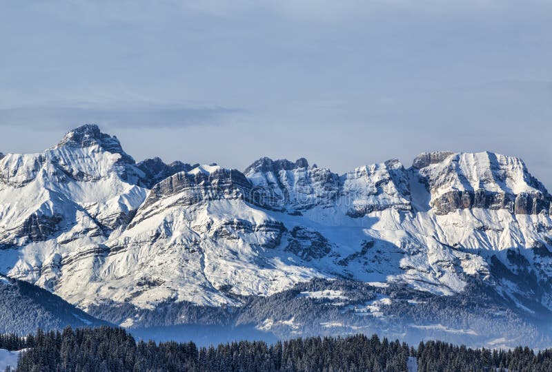 Winter Landscape. Beautiful winter landscape in the Mont Blanc Massif with the view to the Chaine des Aravis above the clouds and villages stock images