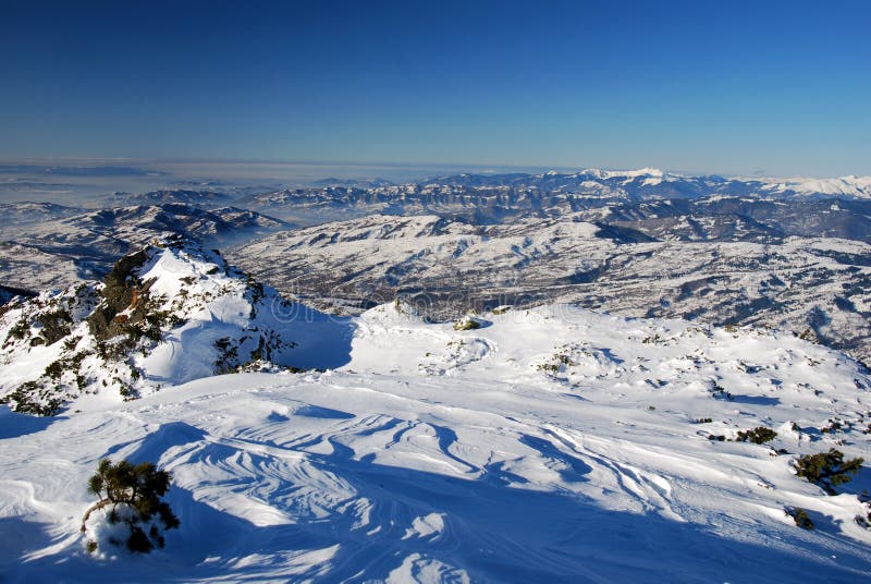 Winter landscape in Rodnei Mountains National Park (Northern Carpathians in Romania). In the image is Viseu Valley and Maramures county landscape with Maramures mountains. Winter landscape in Rodnei Mountains National Park (Northern Carpathians in Romania). In the image is Viseu Valley and Maramures county landscape with Maramures mountains.