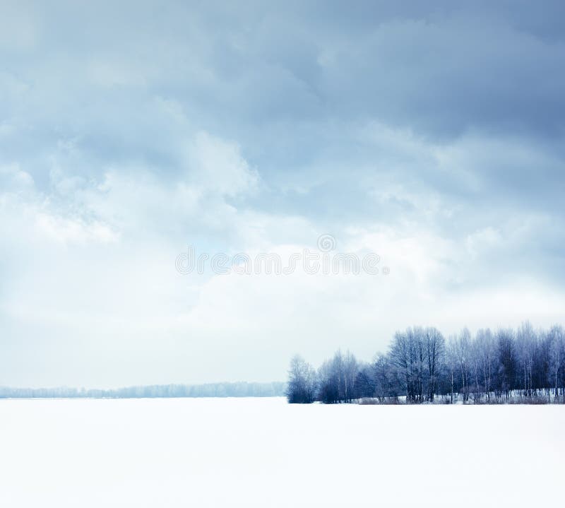 Winter Landscape with Snowy Field and Moody Sky