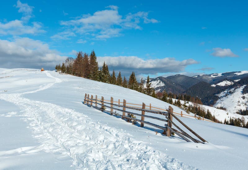 Winter morning mountain rural snow covered path