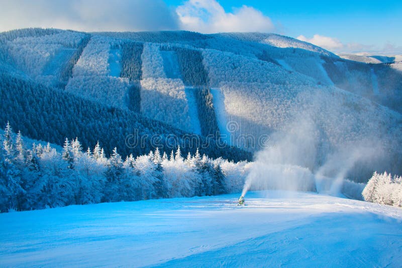 Winter mountain landscape, snow gun