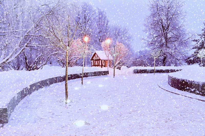 Winter night landscape with illuminated lonely house - winter landscape view with snowflakes royalty free stock photo Winter night landscape with illuminated lonely house - winter landscape view with snowflakes royalty free stock photo