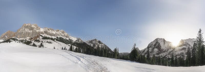 Winter panorama with snowy Alps mountains. Snow-covered nature.