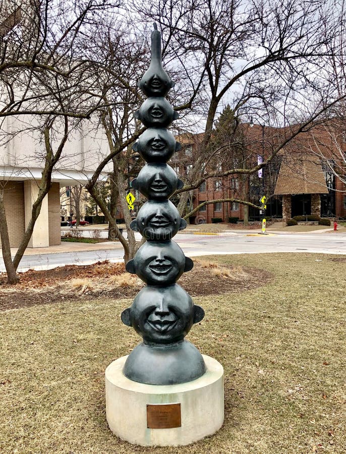 This is a Winter picture of a piece of public art titled: Gourd Man, on exhibit in Village Green located in Skokie, Illinois in Cook County. This sculpture was created by Shen Chen Xu, it was installed in April 2009. This picture was taken on March 7, 2019.