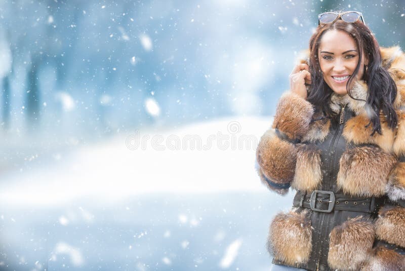 Winter portrait of attractive young woman in warm clothing from polar fox royalty free stock photography Winter portrait of attractive young woman in warm clothing from polar fox royalty free stock photography