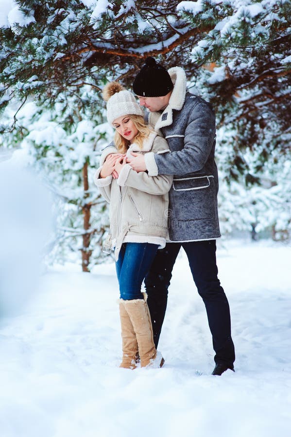 winter portrait of happy couple having fun in snowy forest royalty free stock photo winter portrait of happy couple having fun in snowy forest royalty free stock photo