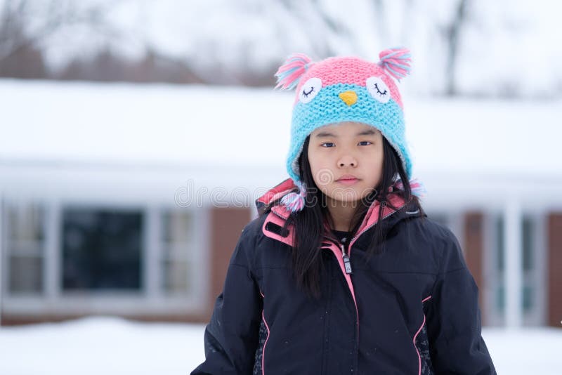 Winter portrait of little child girl wearing knitted hat