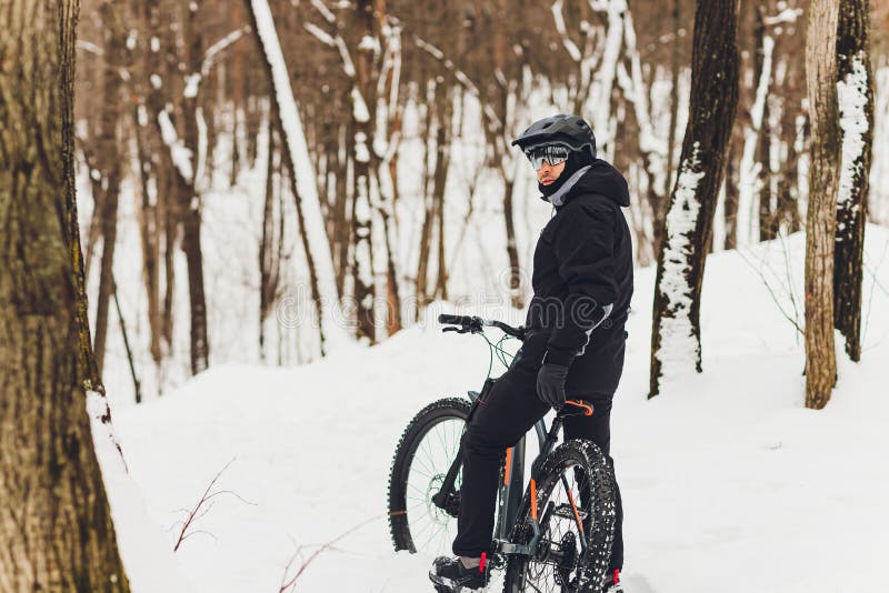 Winter Riding a Mountain Bike in the Forest. Stock Photo Image of biker, mountain 179063104