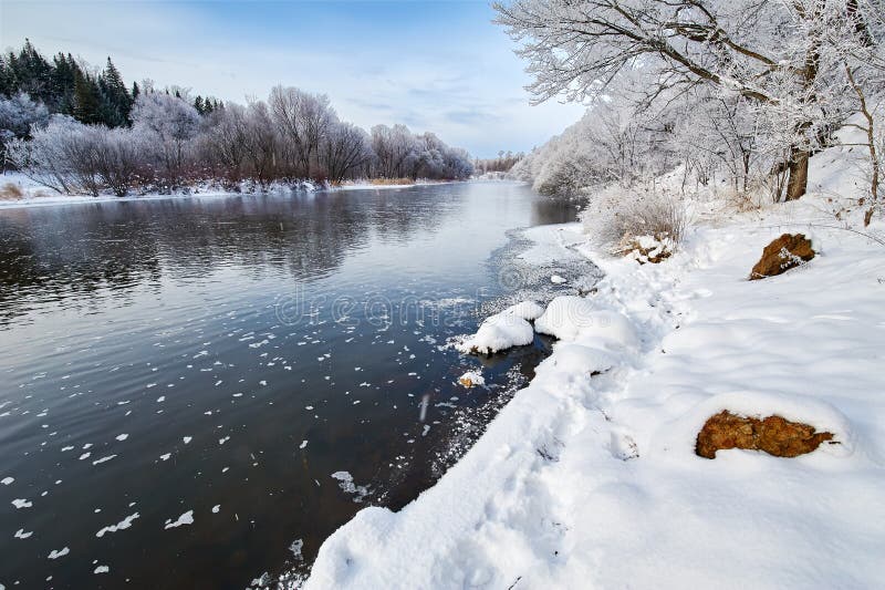 The winter river and snow