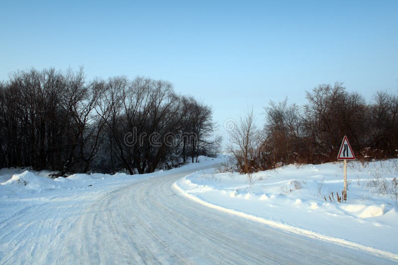 Winter road with sign