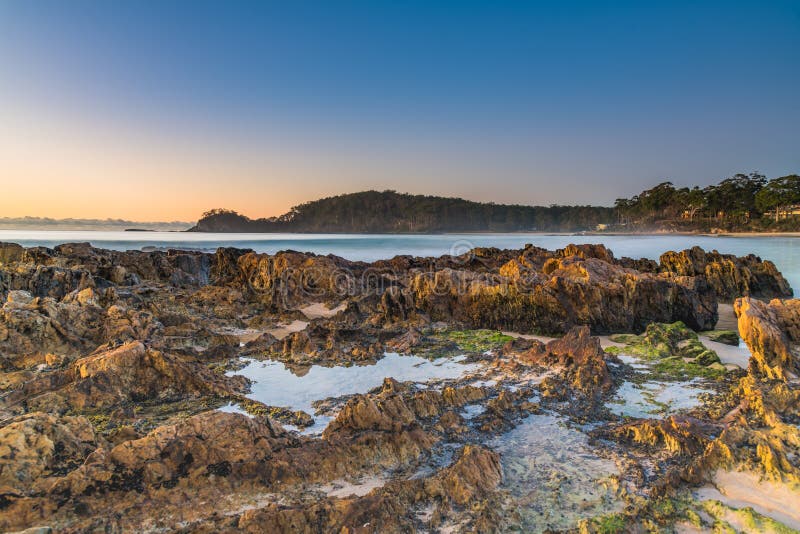 Winter`s Sunrise at Surf Beach with Craggy Rocks