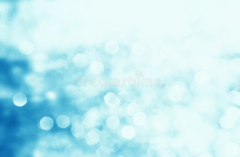 Winter seasonal bokeh background. Blue bokeh light backgrounds. Blue bubble background. Abstract blurred reflection lighting on