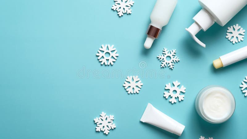 Winter skin care concept. Beauty products packaging design template. Cosmetic cream jar, serum dropper bottle, lipstick, pump