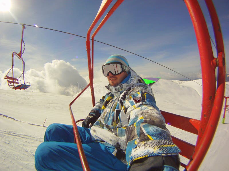 Winter sports - skier using cable car