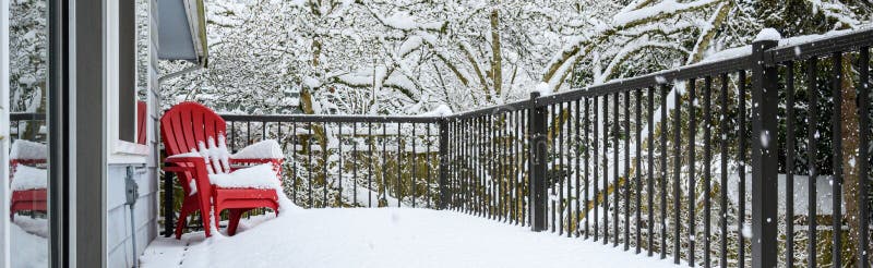 Winter storm, residential deck covered in fresh snow in a winter wonderland