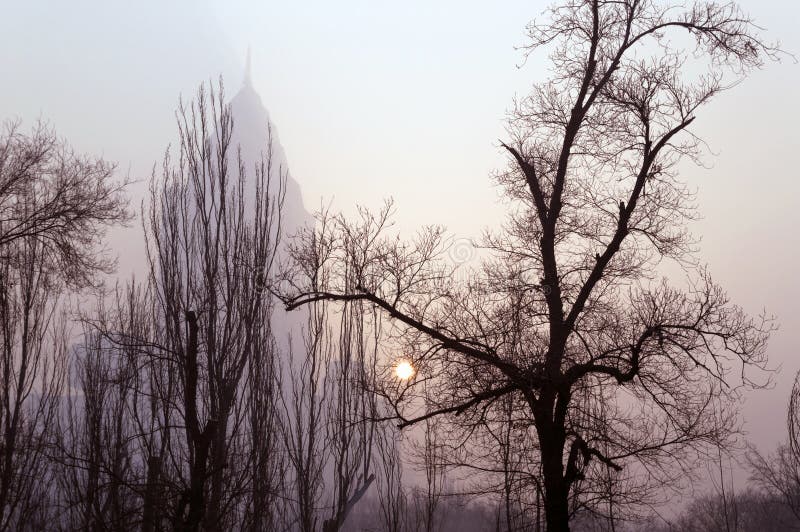 Winter sun glimpse through smog in Urumqi royalty free stock photo Winter sun glimpse through smog in Urumqi royalty free stock photo