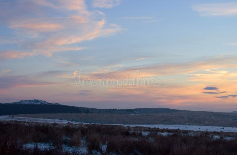 This is the sun just starting to rise near Belliver Tor on the higher part of Dartmoor, there was a severe frost which kept the snow flurries from the previous day frozen. This is the sun just starting to rise near Belliver Tor on the higher part of Dartmoor, there was a severe frost which kept the snow flurries from the previous day frozen.