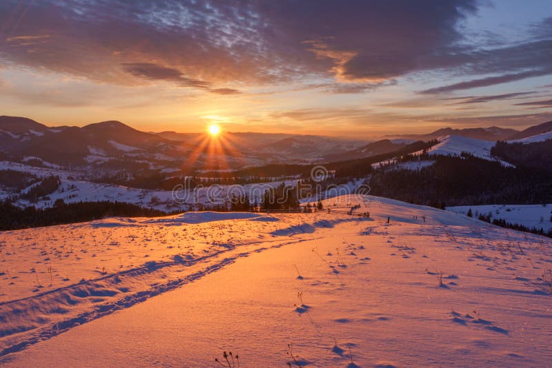 Winter sunrise in the hills mountains.