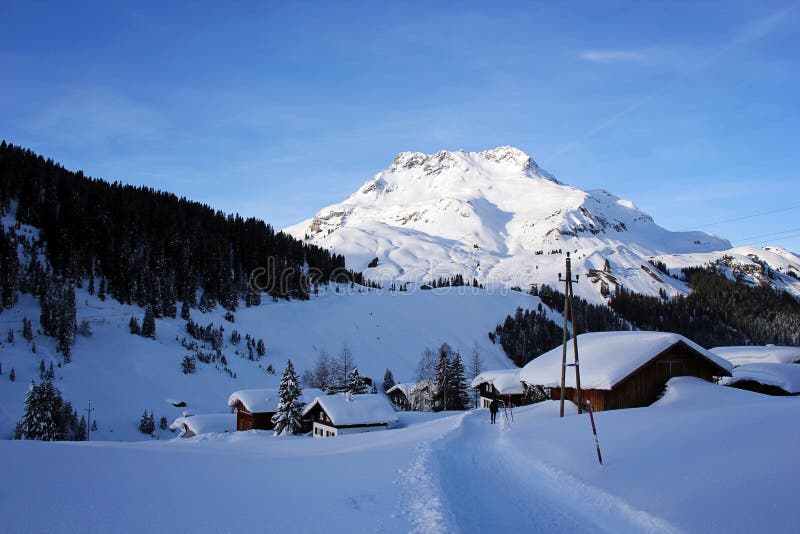 Winter Sunset at the Alps with Beautiful Mountain Peak and View of Stubenbach am Arlberg Ski Resort. Winter Sunset at the Alps with Beautiful Mountain Peak and royalty free stock photos Winter Sunset at the Alps with Beautiful Mountain Peak and View of Stubenbach am Arlberg Ski Resort. Winter Sunset at the Alps with Beautiful Mountain Peak and royalty free stock photos