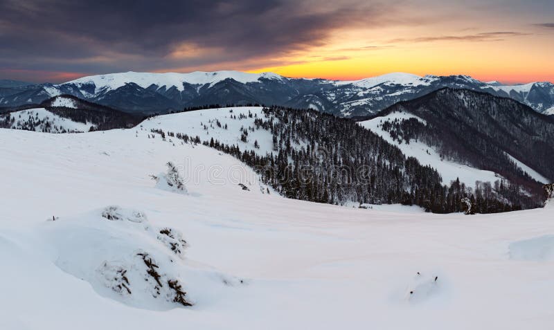 Winter sunset in mountain with cloud