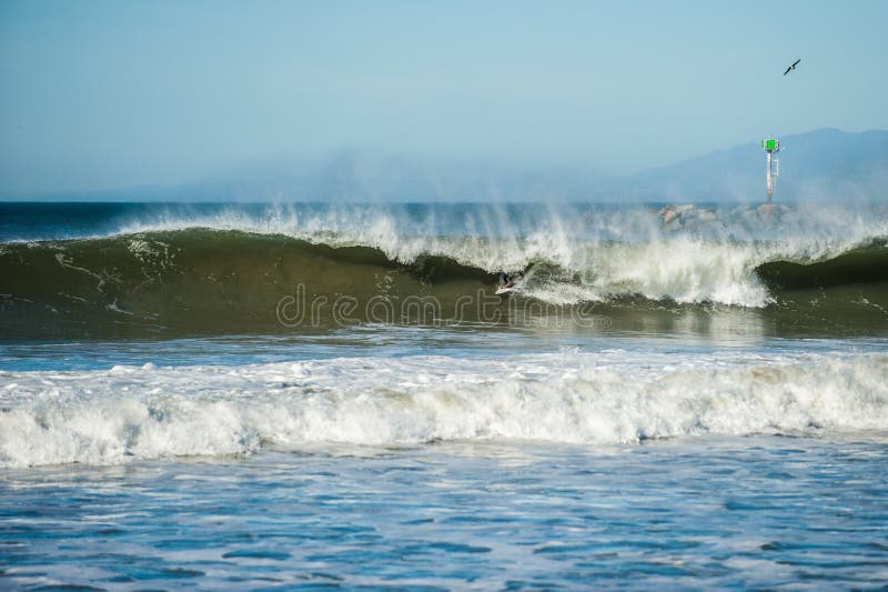 Winter swell and strong winds makes large barrels.