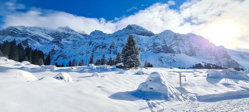 Winter In The Swiss Alps Switzerland Panoramic View Snowy Winter Landscape In The Mountains Winter In The Swiss Alps Switzerland Panoramic View Snowy Winter Landscape In The Mountains