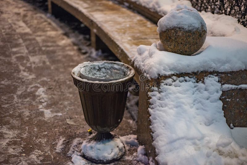 Winter, trashcan on the street under the snow royalty free stock image