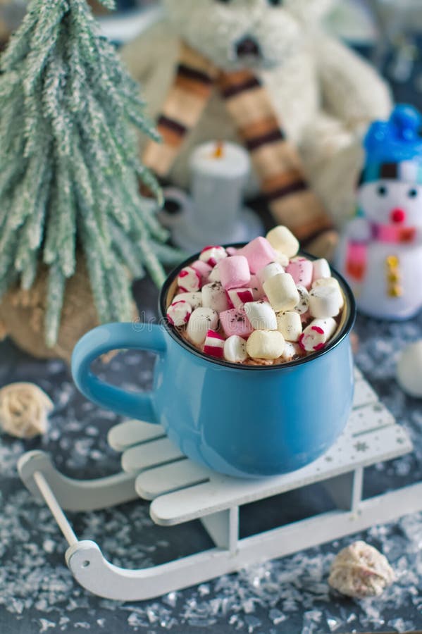 Christmas drink with decorations. Winter warming sweet drink hot chocolate with marshmallows and cocoa in mug and Christmas decorations stock photo Christmas drink with decorations. Winter warming sweet drink hot chocolate with marshmallows and cocoa in mug and Christmas decorations stock photo