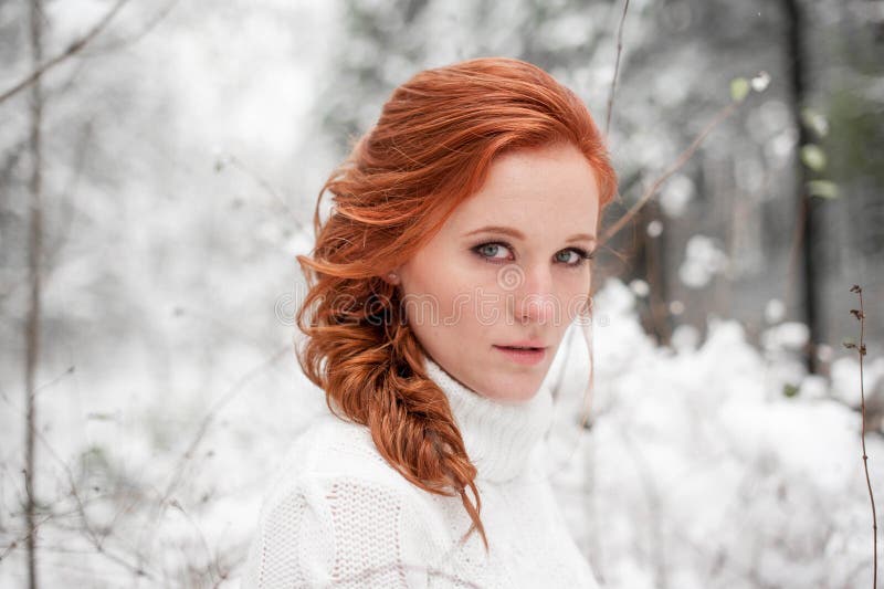 Winter woman portrait in december forest