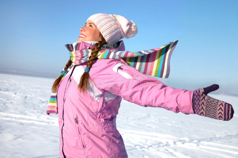 Young beautiful girl happy winter day on the background of snowy landscape. Young beautiful girl happy winter day on the background of snowy landscape