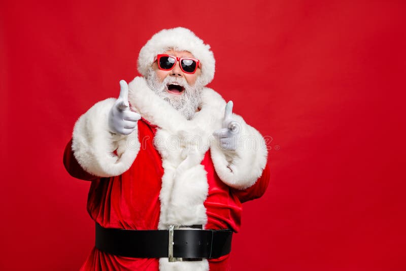 Choose winter season sales. Close up photo of cool stylish trendy santa, indicate discount shopping bargain wear eyeglasses eyewear cap hat  over red background. Choose winter season sales. Close up photo of cool stylish trendy santa, indicate discount shopping bargain wear eyeglasses eyewear cap hat  over red background