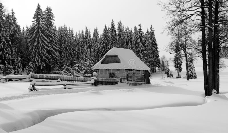 Wintry country with cottage