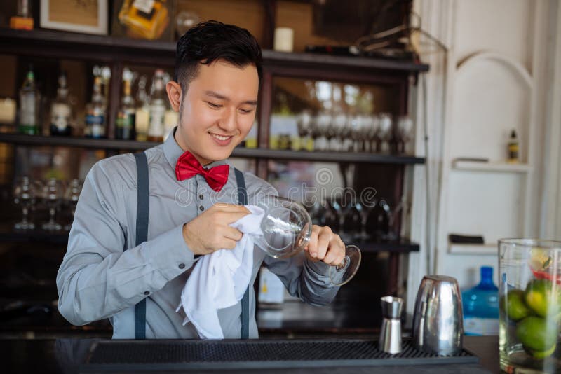 https://thumbs.dreamstime.com/b/wiping-glasses-smiling-young-asian-bartender-wiping-wine-glass-110475973.jpg