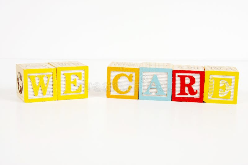 Colorful childrens blocks spell the words we care. Colorful childrens blocks spell the words we care.