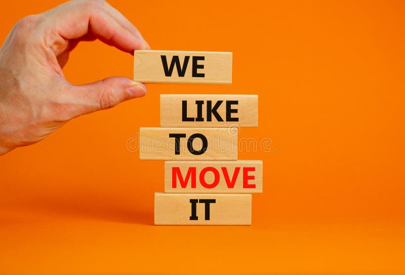 We like to move it symbol. Concept words We like to move it on wooden blocks. Businessman hand. Beautiful orange table orange background. Business motivational We like to move it concept. Copy space. We like to move it symbol. Concept words We like to move it on wooden blocks. Businessman hand. Beautiful orange table orange background. Business motivational We like to move it concept. Copy space