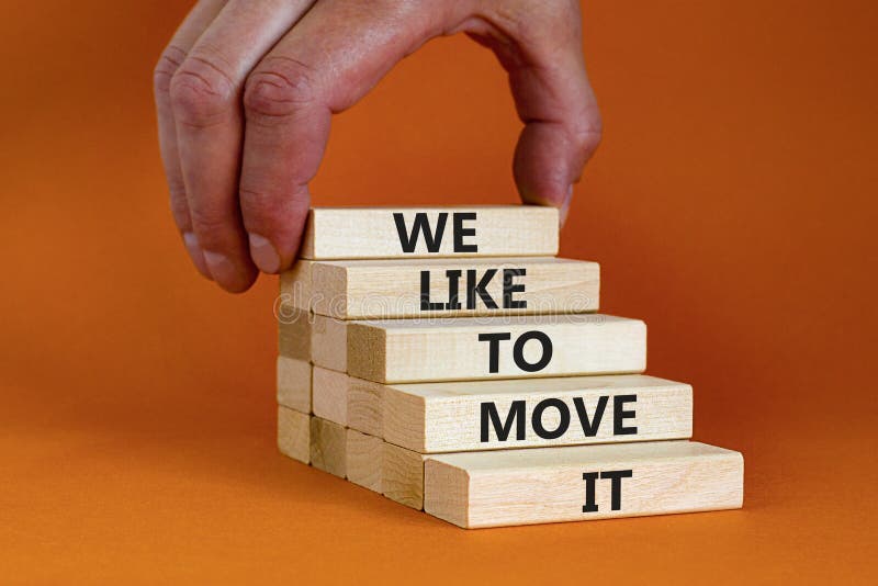 We like to move it symbol. Concept words We like to move it on wooden blocks. Businessman hand. Beautiful orange table orange background. Business motivational We like to move it concept. Copy space. We like to move it symbol. Concept words We like to move it on wooden blocks. Businessman hand. Beautiful orange table orange background. Business motivational We like to move it concept. Copy space