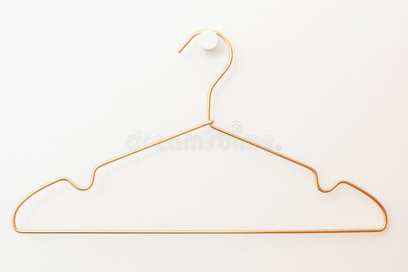 A Wire Hanger Hangs on a Hook Against a White Wall Stock Image Image of close, equipment