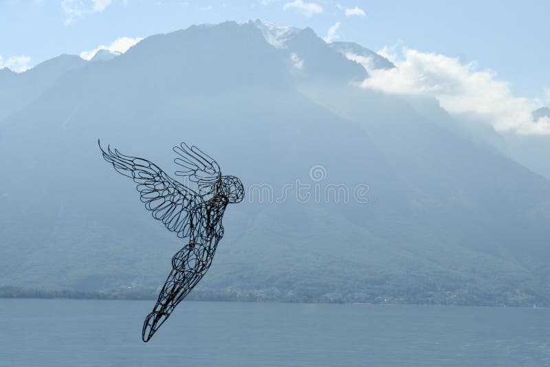 Abstract view of an angel over a lake.